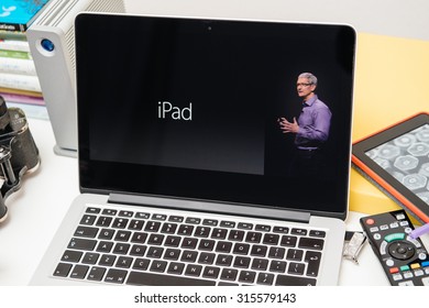 PARIS, FRANCE - SEP 10, 2015: Apple Computers Website On MacBook Pro Retina In A Creative Room Environment With Tim Cook And IPad