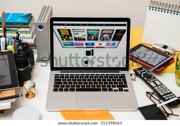 PARIS,\
FRANCE - SEP 10, 2015: Apple Computers website on MacBook Pro\
Retina in a creative room environment showcasing the newly\
announced Apple TV - the future of\
television