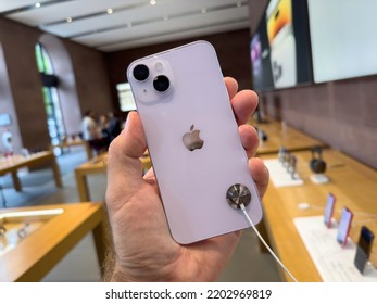 Paris, France - Sep 16, 2022: POV Male Hand Holding New Purple Colored Apple Computers IPhone 14 Plus During The Launch Day Featuring New Dual Powerful Camera Car Crash Detection; And Satellite SOS