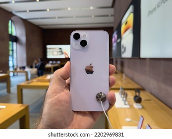 Paris, France - Sep 16, 2022: Customer Holding New Purple Colored Apple Computers IPhone 14 During The Launch Day Featuring New Dual Powerful Camera Car Crash Detection; And Satellite SOS