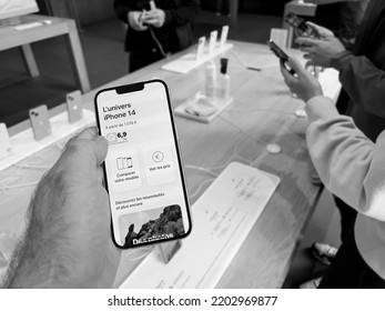 Paris, France - Sep 16, 2022: Customer Holding New Purple Colored Apple Computers IPhone 14 During The Launch Day Featuring New Dual Powerful Camera Car Crash Detection; And Satellite SOS