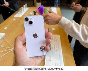 Paris, France - Sep 16, 2022: Customer Holding New Purple Colored Apple Computers IPhone 14 During The Launch Day Featuring New Dual Powerful Camera Car Crash Detection; And Satellite SOS - People In