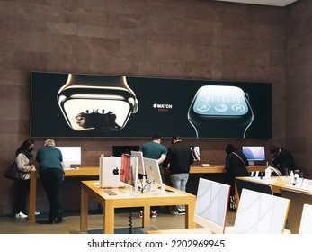 Paris, France - Sep 16, 2022: Busy Crowd Inspecting New Apple IMac Computers With Large Advertising OOH For The New Watch Series 8 With Features: Cycle Tracking And Crash Detection Two New Temperature