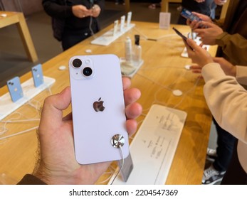 Paris, France - Sep 16, 2022: Customer Holding New Purple Colored Apple Computers IPhone 14 During The Launch Day Featuring New Dual Powerful Camera Car Crash Detection And Satellite SOS