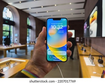 Paris, France - Sep 16, 2022: POV Male Hand Holding New Purple Colored Apple Computers IPhone 14 During The Launch Day Featuring New Dual Powerful Camera Car Crash Detection And Satellite SOS