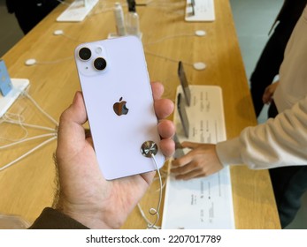 Paris, France - Sep 16, 2022: Customer Holding New Purple Colored Apple Computers IPhone 14 During The Launch Day Featuring New Dual Powerful Camera Car Crash Detection And Satellite SOS - People In