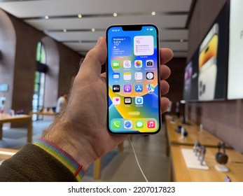 Paris, France - Sep 16, 2022: POV Male Hand Holding New Purple Colored Apple Computers IPhone 14 During The Launch Day Featuring New Dual Powerful Camera Car Crash Detection And Satellite SOS