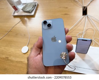 Paris, France - Sep 16, 2022: Customer Holding New Sky Blue Colored Apple Computers IPhone 14 During The Launch Day Featuring New Dual Powerful Camera Car Crash Detection; And Satellite SOS