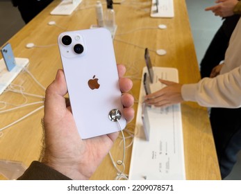 Paris, France - Sep 16, 2022: Customer Holding New Purple Colored Apple Computers IPhone 14 During The Launch Day Featuring New Dual Powerful Camera Car Crash Detection; And Satellite SOS - People In