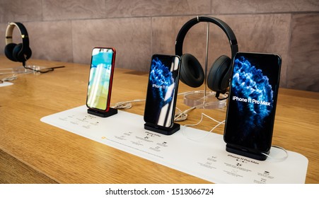 Paris, France - Sep 20, 2019: The new iPhone 11, 11 Pro and Pro Max range displayed in Apple Store next to Beats by Dr Dre Headphones as the smartphone by Apple Computers goes on sale