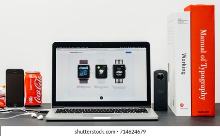 PARIS, FRANCE - SEP , 2017: Minimalist creative room table with Safari Browser on MacPook Pro laptop at Apple Computers website latest Apple Watch Series 3 with built-in cellular