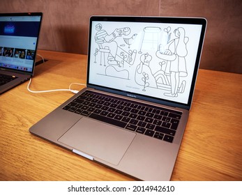 Paris, France - Sep 22, 2017: New Apple MacBook Pro Professional Laptop With Motion Wallpaper Inside Apple Store - Including Touch Bar