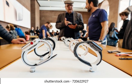 PARIS, FRANCE - SEP 22, 2017: New Apple Watch Series 3 goes on sale in Apple Store with Apple Genius Explaining to customer about Watch advantages - multiple wathces in a row 