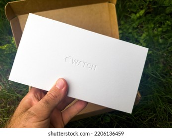 Paris, France - Sep 23, 2022: Unboxing In Green Garden Pacakge With New Titanium Apple Watch Ultra Designed For Extreme Activities Like Endurance Sports, Elite Athletes, Trailblazing, Adventure -