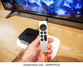 Paris, France - Sep 24, 2021: POV Personal Perspective Male Hand Holding Latest Apple Computers TV 4K UHD With New Siri Remote Control