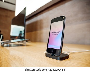 Paris, France - Sep 24, 2021: Vintage Apple iPod Touch with price tag 249 euros for sale in Apple Store used as a music player and a handheld gaming device, but it can also be used as a digital camera