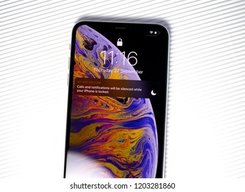 PARIS, FRANCE - SEP 25, 2018: Part Of The New IPhone Xs Max Smartphone Model By Apple Computers Close Up With Do Not Disturb Icon On Screen