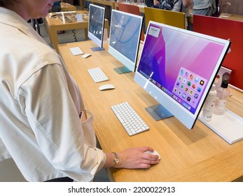 Paris, France - Sep 9, 2022: Woman Looking At The New Colorful IMac Computer Deciding Which One To Buy - Apple Store Shopping