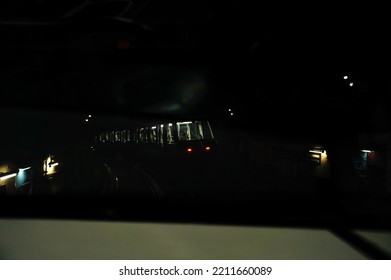 Paris, France - Sept. 2022 - Motion-blurred Shot Of A Metro Train, Rolling Inside An Underground Tunnel ; The Interior Of The Train Is Lit, While The Outside Is Dark, Which Creates A Clair-obscur