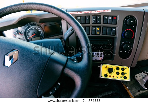 PARIS, FRANCE -SEPT 5, 2014:\
Interior of modern Renault Industrial sewer cleaning truck with\
vacuum and hydro excavation - buttons, steering wheel, dashboard\
command