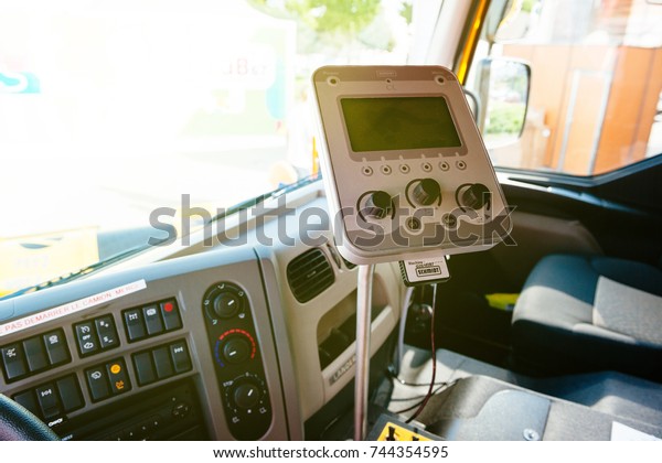 PARIS, FRANCE -SEPT\
5, 2014: Interior of modern Renault Industrial sewer cleaning truck\
with vacuum and hydro excavation - buttons, steering wheel,\
dashboard command Schmidt\
tech