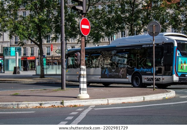 Paris, France - September 05, 2022 Bus driving\
through the streets of Paris, Buses are inexpensive and drop you\
off at any location in the capital quite quickly, many of its buses\
run on gas\
