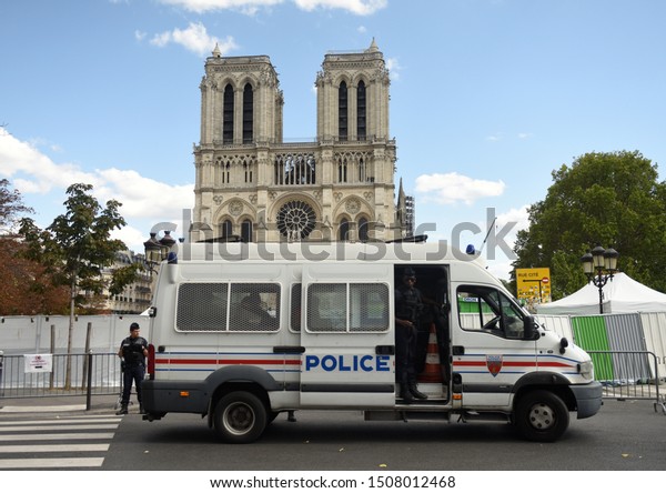 Paris, France - September 1,\
2019: Police near the Cathedrale Notre-Dame de Paris in Paris,\
France. 