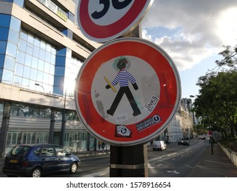 Paris, France - September 11 2019 : Pedestrian Crosswalk Walk Warning Street Sign. Silhouette With French Cliche : Baguette, French Beret, Breton Stripes Shirt