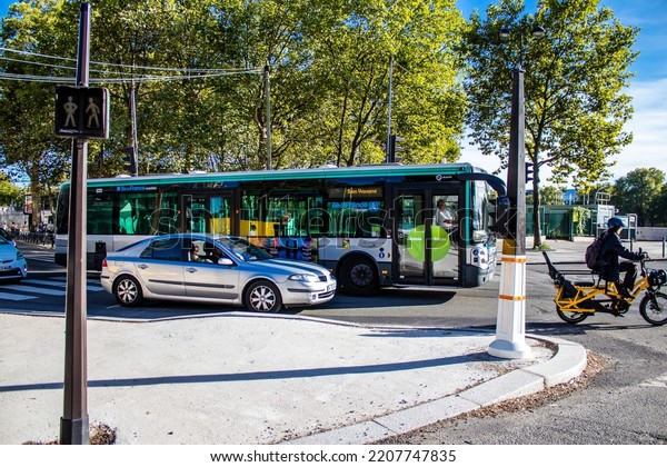 Paris, France - September 14, 2022 Bus driving\
through the streets of Paris, Buses are inexpensive and drop you\
off at any location in the capital quite quickly, many of its buses\
run on gas