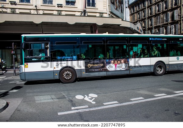 Paris, France - September 14, 2022 Bus driving\
through the streets of Paris, Buses are inexpensive and drop you\
off at any location in the capital quite quickly, many of its buses\
run on gas