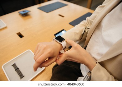 PARIS, FRANCE - SEPTEMBER 16, 2016: New Apple Watch Series 2 Tested By Woman After Purchase - Looking At The New Strap, Activity App. New Apple Watch Tends To Become Popular Wearable Device In 2016