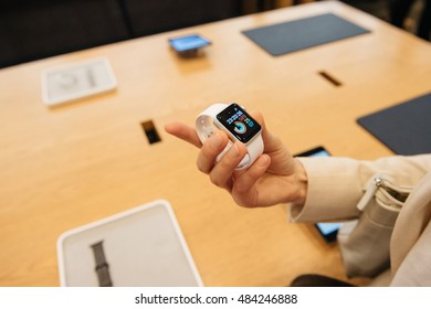 PARIS, FRANCE - SEPTEMBER 16, 2016: New Apple Watch Series 2 Tested By Woman After Purchase - Looking At The New Strap, Activity App. New Watch Tends To Become One Of The Most Popular Wearable Device