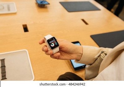 PARIS, FRANCE - SEPTEMBER 16, 2016: New Apple Watch Series 2 Tested By Woman After Purchase - Looking At The New Strap, Activity App. New Watch Tends To Become One Of The Most Popular Wearable Device