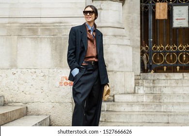 PARIS, FRANCE - SEPTEMBER 30, 2019: Julie Pelipas wears double-breasted jacket, oversized pants and sunglasses outside STELLA McCARTNEY show, during Paris Fashion Week Womenswear Spring/Summer 2020.