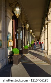 PARIS, FRANCE - SEPTEMBER 7, 2018: Unidentified People Walk Along Famous Arcade On Rivoli Street Near Hotel Le Meurice, Paris, France