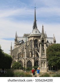 Paris, France - September 9, 2014 : A Middle-aged Couple take a Picture of Notre Dame. It is One of the Finest Examples of French Gothic Architecture.