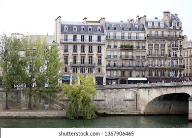 Paris, France - September, 9, 2019: Beautiful ancient buildings in Paris. Waterfront in Paris. River Seine and old architecture in Paris. Free lens photography