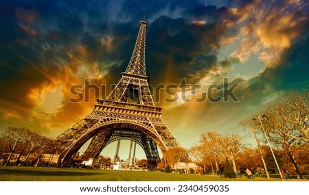 Paris, France. Wonderful view of Tour Eiffel with gardens and colourful sky.