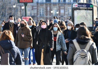 Paris, France-03 02 2021:People Wearing Protective Face Masks In A Crowded Street Of Paris, France, During The Global Coronavirus Epidemic.