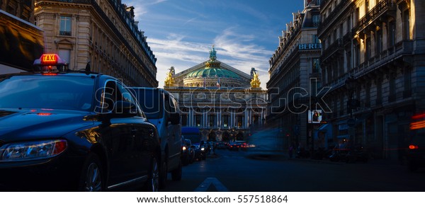 Paris,\
France-circa 2016:Traffic cars in front of Opera, Paris. The Palais\
Garnier is a 1,979-seat opera house, which was built from 1861 to\
1875 for the Paris Opera.color\
grading