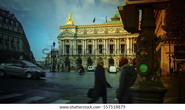 Paris,\
France-circa 2016:Traffic cars in front of Opera, Paris. The Palais\
Garnier is a 1,979-seat opera house, which was built from 1861 to\
1875 for the Paris Opera.color\
grading