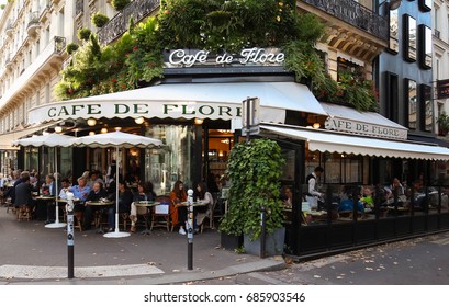 Paris, France-JULY 25, 2017: The Famous Cafe De Flore Located At The Corner Of Boulevard Saint Germain And Rue Saint Benoit. It Was Once Home To Intellectual Stars , From Hemingway To Pablo Picasso.