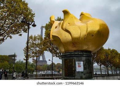 Paris, France-October 7,2018: The Flame Of Liberty Of The Place De LAlma,  Pictures Of Princess Diana Are Attached,   As A Memorial, Near The Site Of The Fatal Car Crash. 