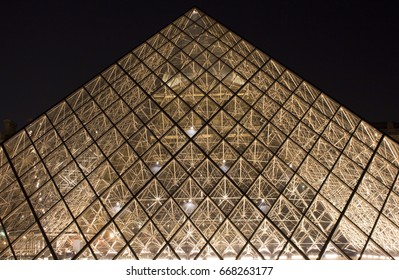 PARIS - JANUARY 17, 2017: Close Up View Of Glass Pyramid At Louvre Museum (Musee Du Louvre). Former Historic Palace Housing Huge Art Collection, From Roman Sculptures To Da Vinci's 