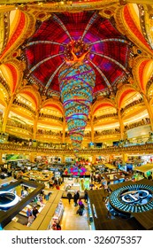 PARIS, JANUARY 3RD, 2015: The unique upside-down Christmas tree at Galeries Lafayette. Galeries Lafayette is an upmarket French department store chain that has been selling luxury goods since 1895.
