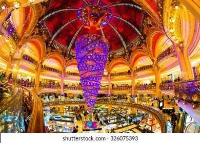 PARIS, JANUARY 3RD, 2015: The unique upside-down Christmas tree at Galeries Lafayette. Galeries Lafayette is an upmarket French department store chain that has been selling luxury goods since 1895.