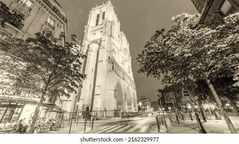 PARIS - JUNE 12, 2014: Tourists Walk Near Notre Dame. Paris Is Visited By More Than 40 Million People Annually.