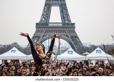 PARIS - MARCH 24: Dancer In Traditional Persian Costume And Eiffel Tower At Background As Seen On March 24, 2013 In Paris, France. Iranian Community In Paris Celebrates The Nowruz (Iranian New Year).