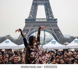 PARIS - MARCH 24: Dancer In Traditional Persian Costume And Eiffel Tower At Background As Seen On March 24, 2013 In Paris, France. Iranian Community In Paris Celebrates The Nowruz (Iranian New Year).