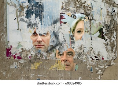 Paris. March 26, 2017 - French Elections 2017: Wall With Scratched Pictures Of Emmanuel Macron, François Fillon And Marine Lepen.